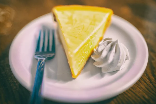 Key lime pie slice at Florida restaurant in the Keys. World famous american traditional dessert homemade, with whipped cream topping on the side. Local food, USA travel