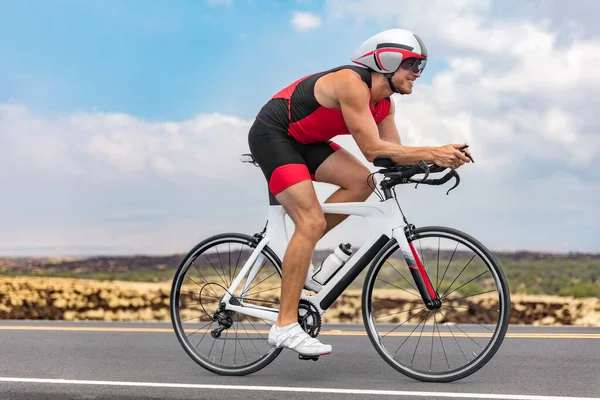 Triathlon cyclist man cycling racing on road bike on ironman competition racing against time. Triathlete training bicycle workout for triathlon race — Stock Photo, Image