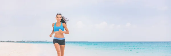 Healthy running girl jogging on beach training cardio. Exercise outside in summer background panorama banner. Asian woman happy morning motivation. Active people lifestyle — Stock Photo, Image