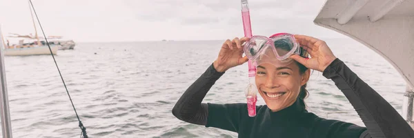 Snorkel mask Asian woman tourist getting ready for snorkeling activity tour from boat banner panorama ストックフォト