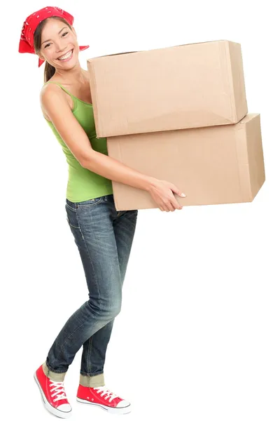 Woman carrying moving boxes — Stock Photo, Image
