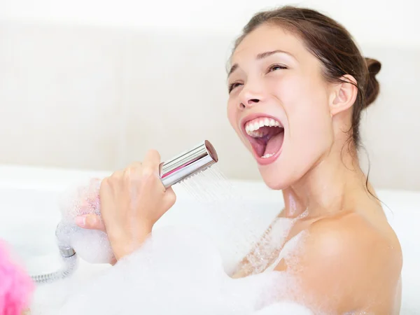 Woman singing in bath shower — Stock Photo, Image