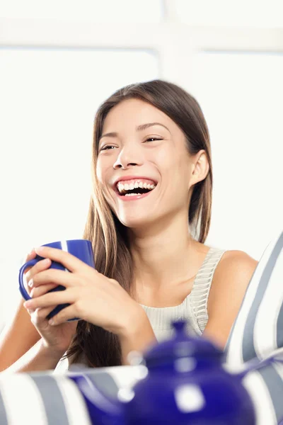 Woman laughing drinking tea — Stock Photo, Image