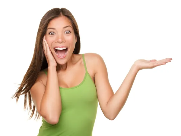 Surprised woman showing product — Stock Photo, Image