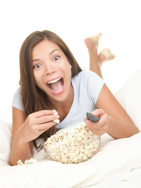 Watching fun movie - woman in bed — Stock Photo, Image