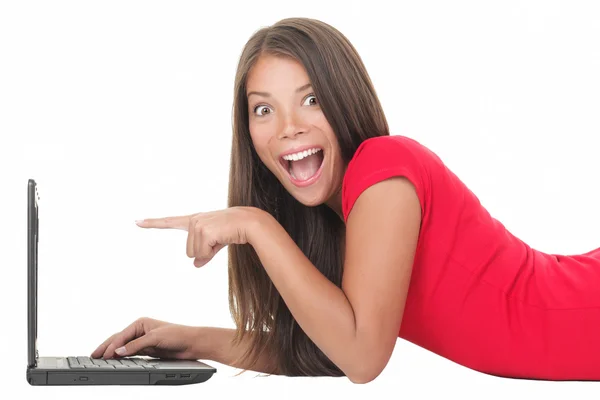 Kvinna upphetsad med laptop Royaltyfria Stockfoton