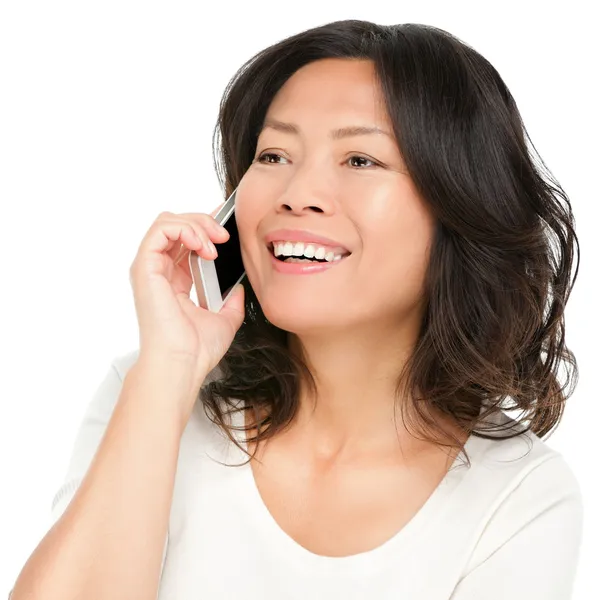 Asian mature woman talking on mobile phone — Stock Photo, Image