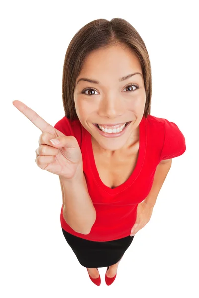 Grinning mulher apontando para a esquerda da moldura — Fotografia de Stock