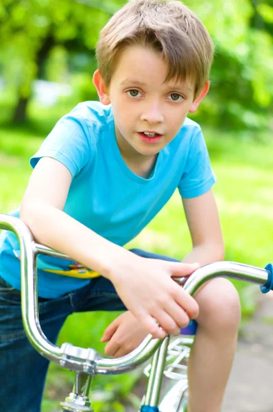 Boy riding bicycle — Stock Photo, Image