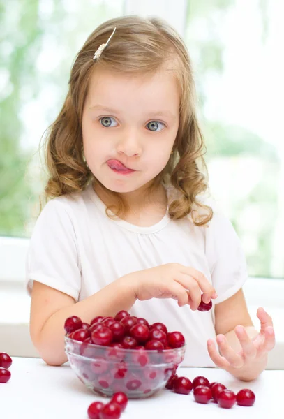 Girl with cherry Stock Picture