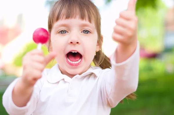 Niño con piruleta —  Fotos de Stock