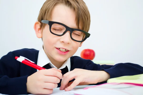 Schoolboy writing homework — Stock Photo, Image