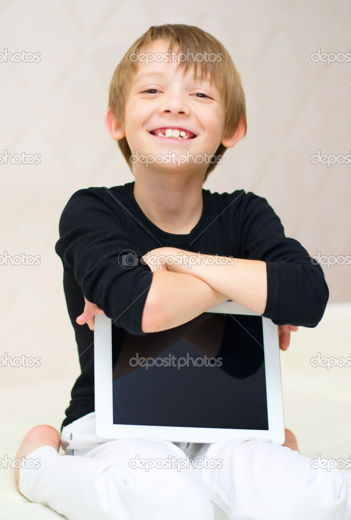 boy using tablet computer