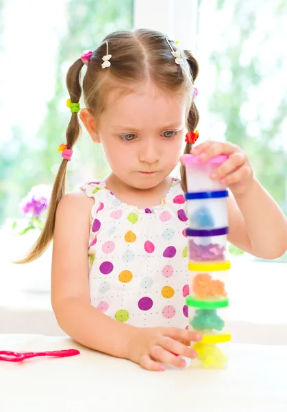 Child is playing with colorful dough — Stock Photo, Image