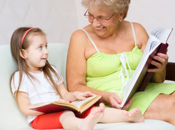 Great-grandmother reading a book — Stock Photo, Image