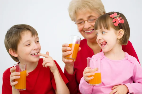 Family drinking juice — Stock Photo, Image