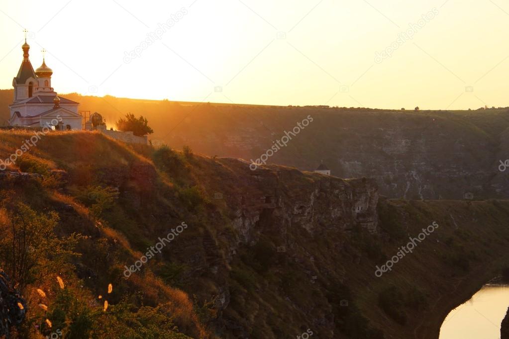 Rural scenic view of Orheiul Vechi church at sunset