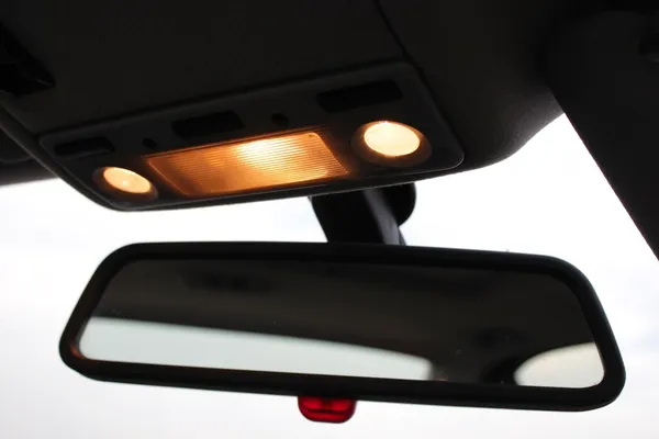 Car rearview mirror with indoors lights — Stock Photo, Image