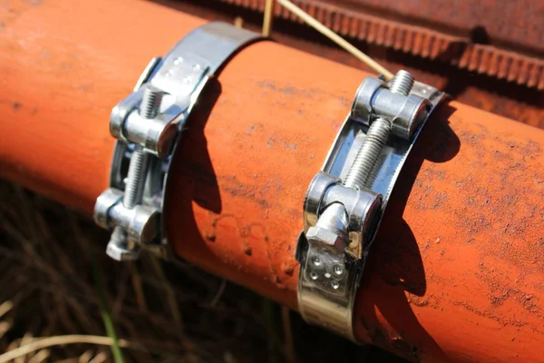 Clamps on the pipe — Stock Photo, Image