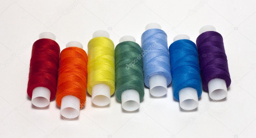 Rainbow colored spool of thread