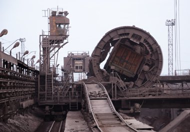 Rail-car dumper at the steel mill clipart