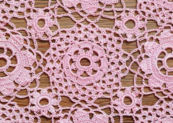 Crochet lace on a wooden surface