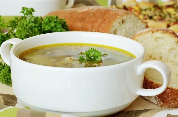 Soup with meatballs and parsley — Stock Photo, Image