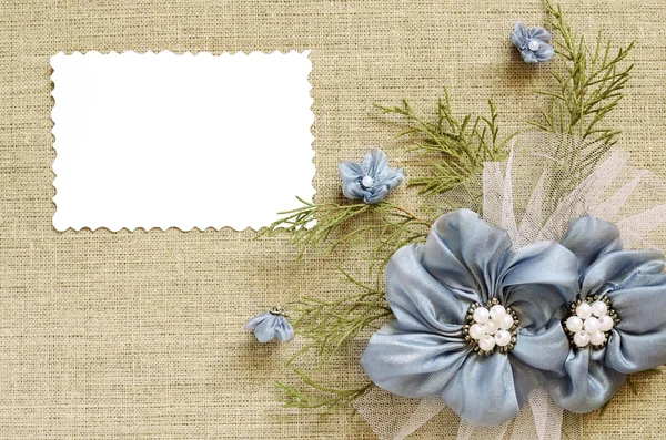 Background with a flower arrangement and a card — Stock Photo, Image