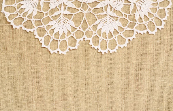 Canvas background with crochet lace — Stock Photo, Image