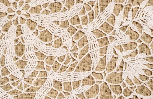 Canvas with crochet lace — Stock Photo, Image