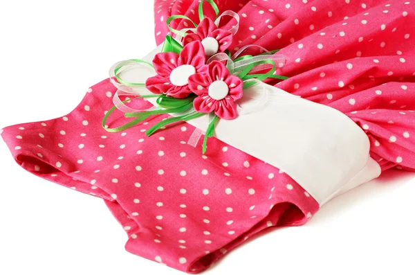 Vestito rosa a pois con fiori tessili artificiali — Foto Stock