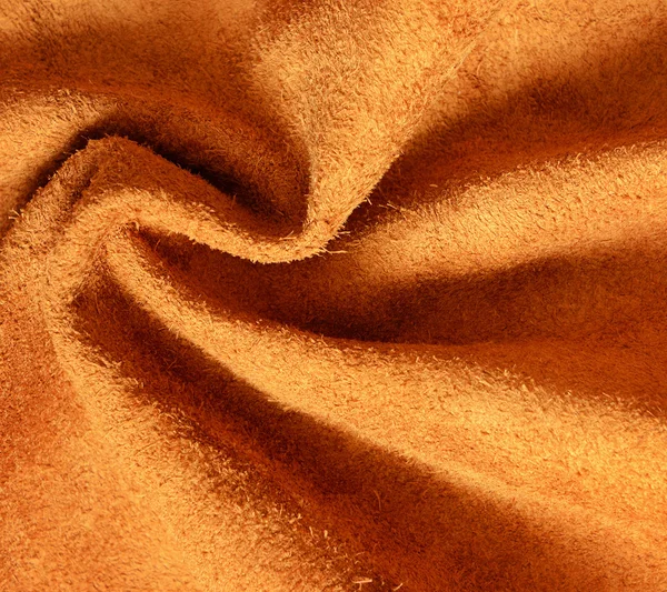 棕褐色绒面革披上为背景 — 图库照片