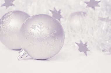 Christmas balls with tinsel and stars clipart