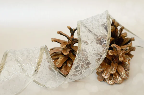 Pinecones and glitter tape — Stock Photo, Image