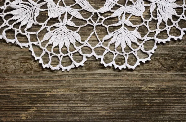 Crochet lace on wood — Stock Photo, Image