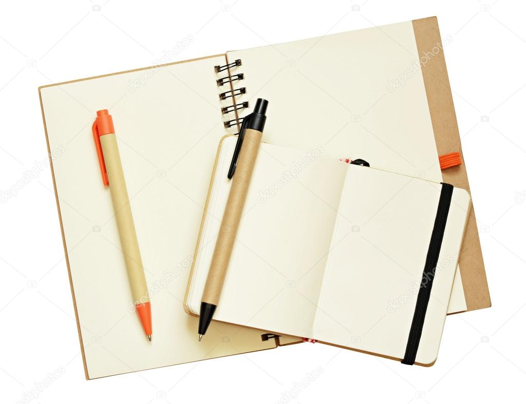 Opened notebooks and pens
