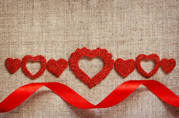 Hearts line and ribbon on canvas — Stock Photo, Image