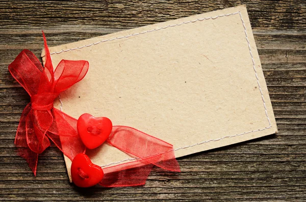 Two hearts tied with red ribbon Royalty Free Stock Images