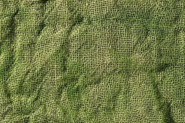 Зеленый фон мешковины — стоковое фото