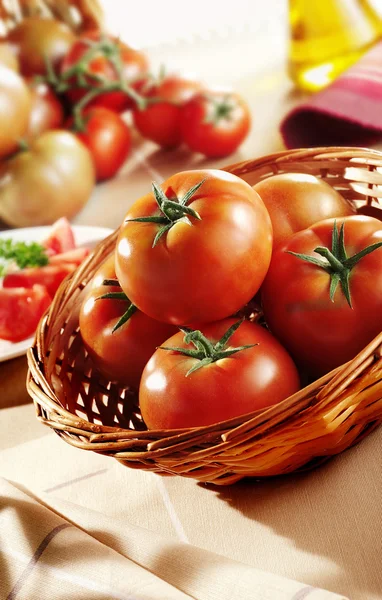 Tomatoes in basket — Stock Photo, Image