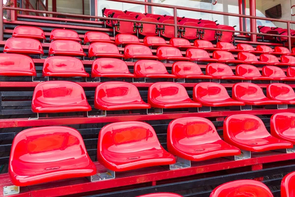 Red plastic seats in stadium — Stock Photo, Image