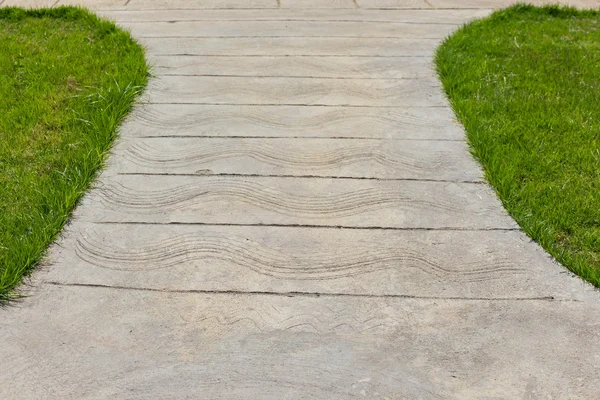 Concrete walkway and grass — Stock Photo, Image