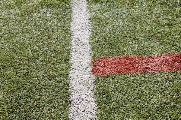 Campo de futebol de grama artificial ou campo de futsal interior — Fotografia de Stock