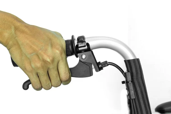 Main avec fauteuil roulant handebar sur la rupture — Photo