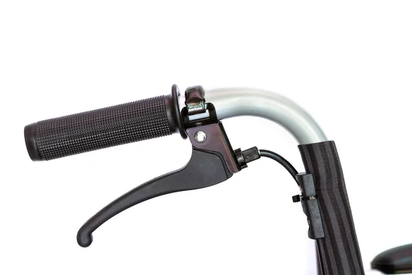 Detalhe da handebar cadeira de rodas com pausa — Fotografia de Stock