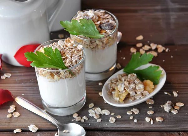 Small glasses of plain yogurt with muesli — Stock Photo, Image