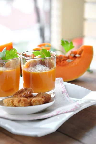 Two glasses with pumpkin soup and bread — Stock Photo, Image