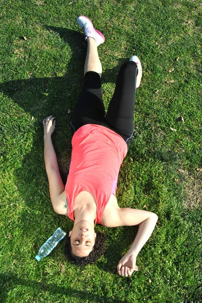 Athlete tired and lying — Stock Photo, Image