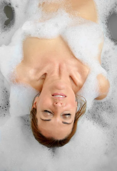 Woman bathing with a lot of foam — Stock Photo, Image