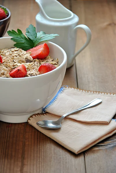 Bowl of cereal with milk and strawberries — Stock Photo, Image